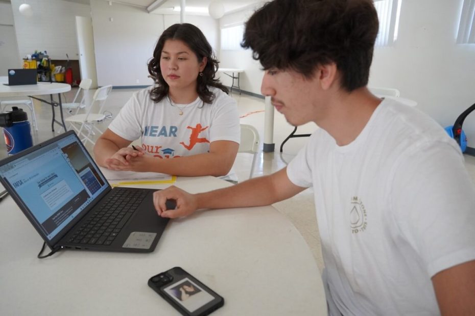 People at computer screen looking at FASFA